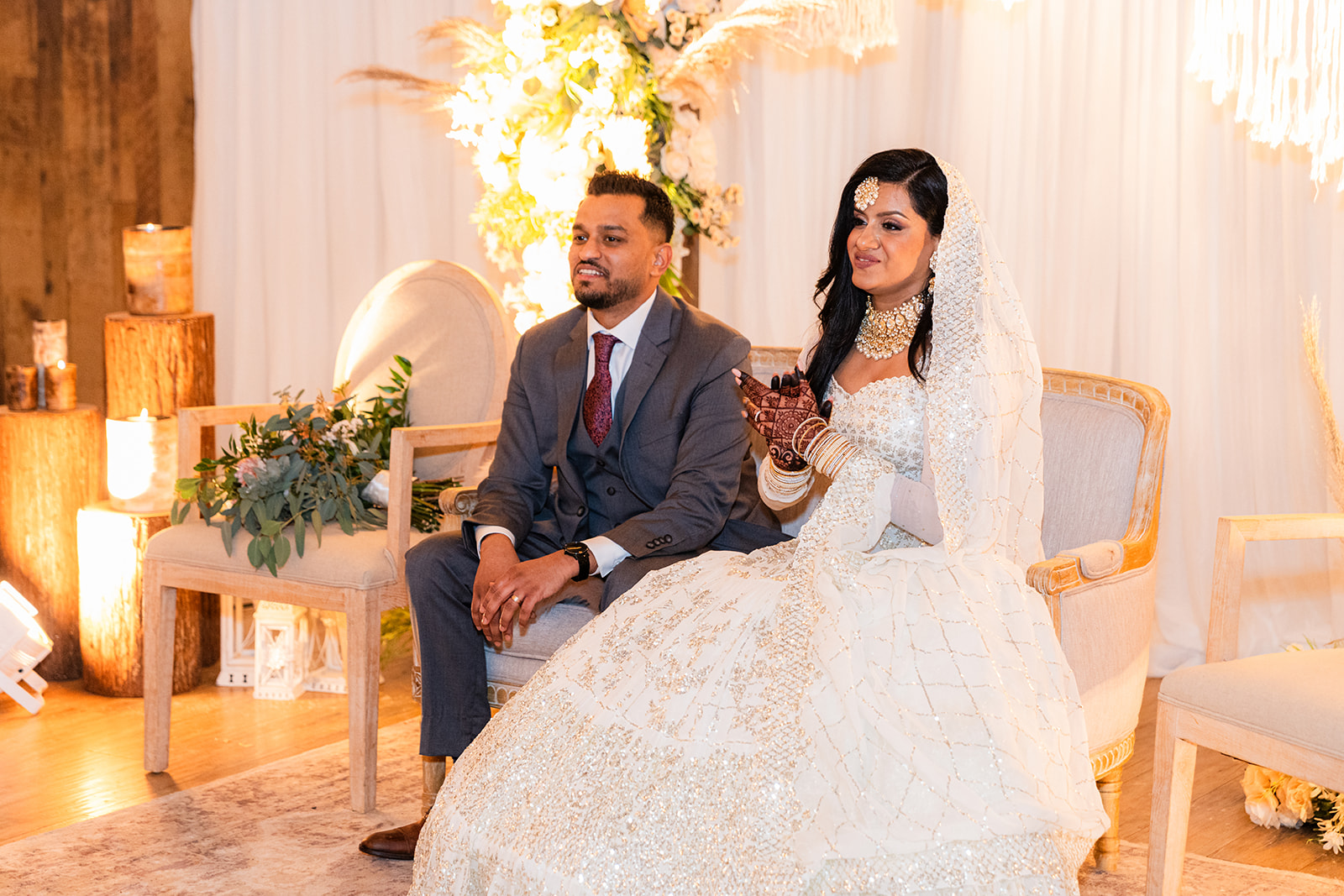 Bride and groom seated during their wedding celebration